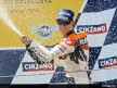 Dani Pedrosa celebrating his victory on the podium at Catalunya