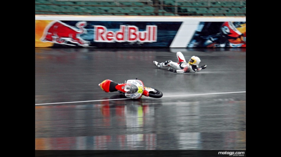Romanian rider Robert Muresan crashes in the first practice session at Indianapolis