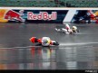 Romanian rider Robert Muresan crashes in the first practice session at Indianapolis