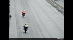 Valentino Rossi riding ahead Nicky Hayden at Indianapolis
