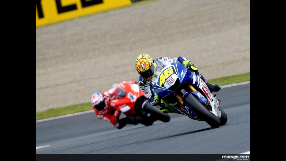 Valentino Rossi riding ahead of Casey Stoner in Motegi
