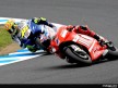 Casey Stoner and Valentino Rossi in action in Motegi