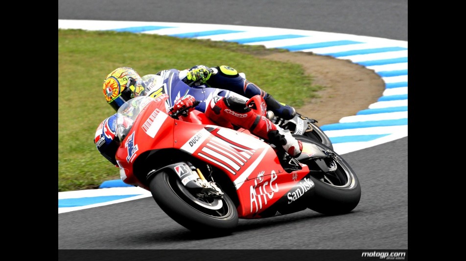 Casey Stoner riding side-by-side with Valentino Rossi in Motegi