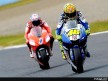 Valentino Rossi riding ahead of Casey Stoner in Motegi