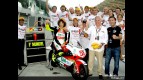 Simoncelli celebrates his 250cc World title with the Metis Gilera team