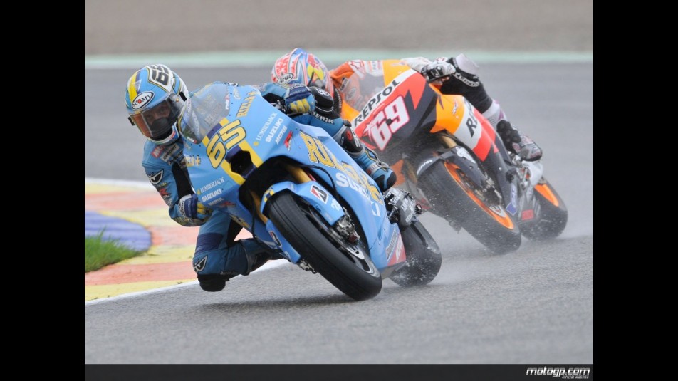 Loris Capirossi riding ahead of Nicky Hayden during Practice in Valencia
