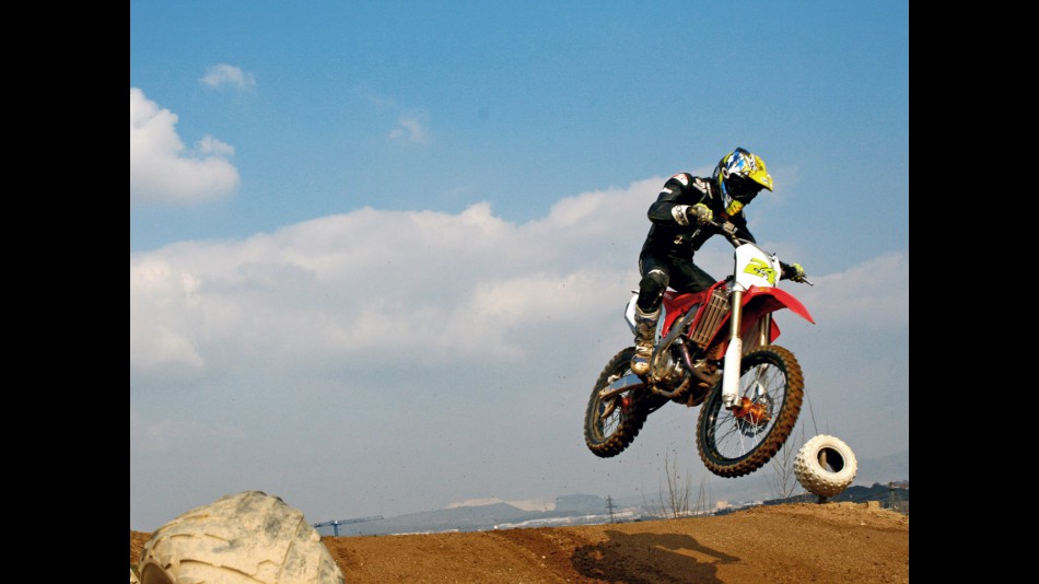 Toni Elias training on Motocross machinery