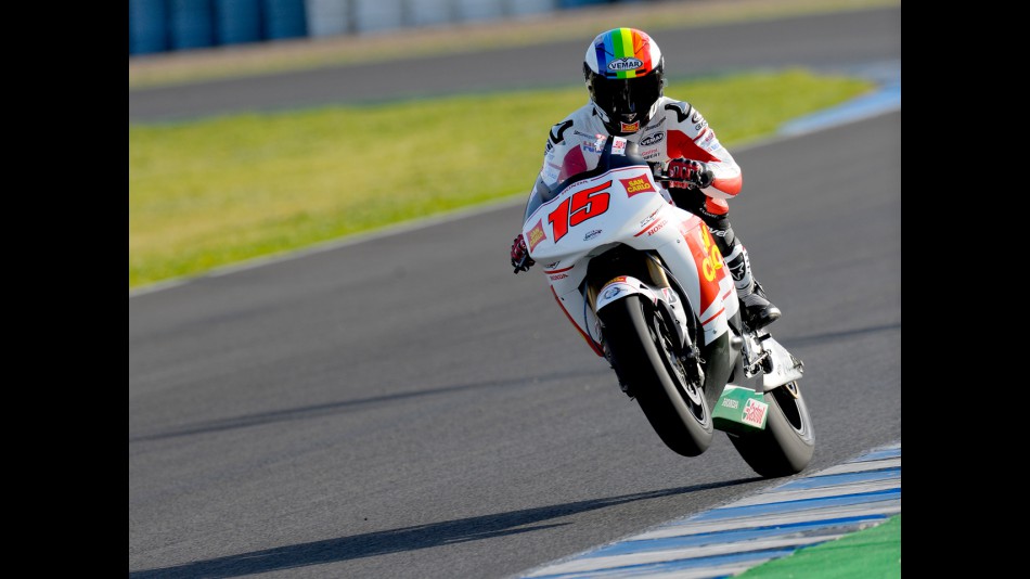 Alex de Angelis pulling a wheelie at the Official Test in Jerez