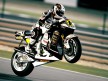 Randy de Puniet pulls off a wheelie in Qatar