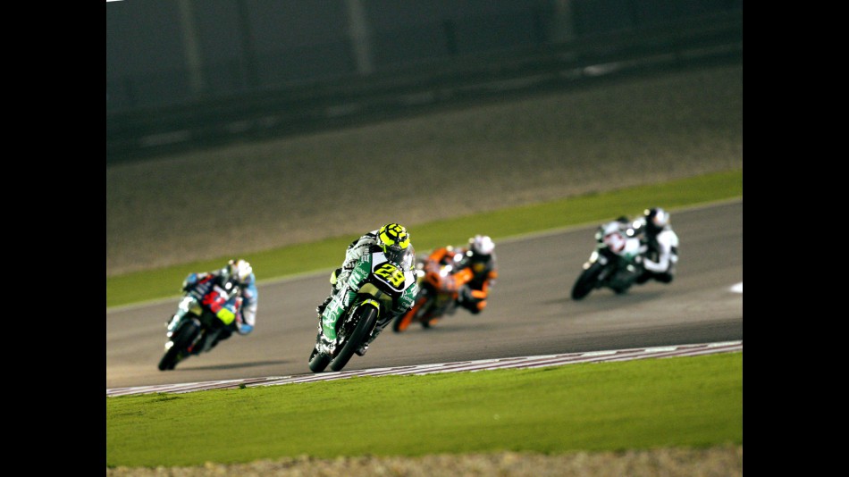 Andrea Iannone riding ahead of 125cc group