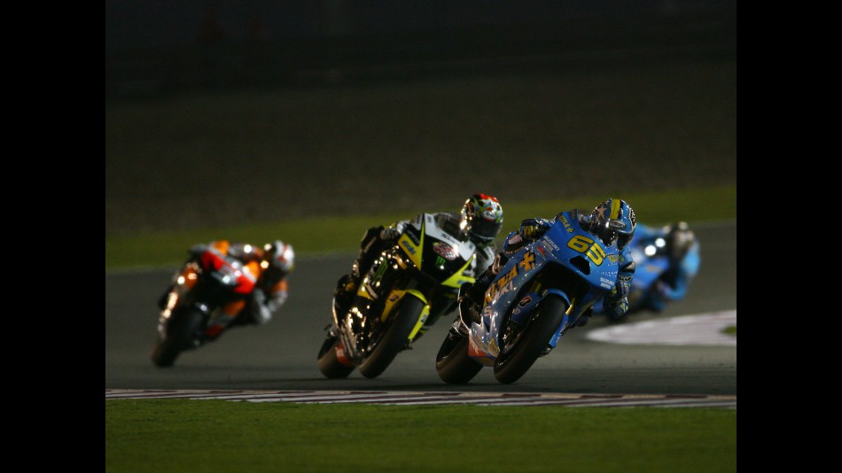 Capirossi ahead of Edwards in the early stages of the race at Losail