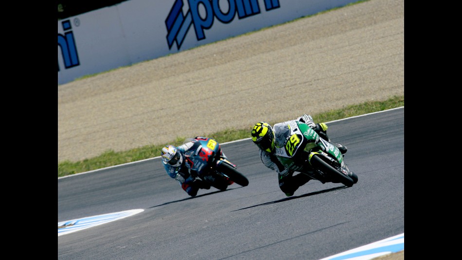 Andrea Iannone riding ahead of Julian Simon during 125cc race in Motegi