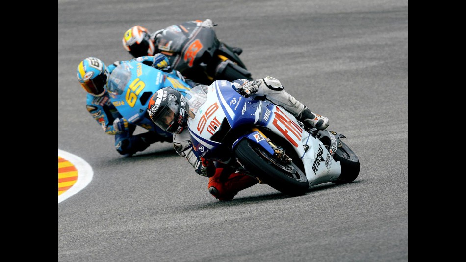 Jorge Lorenzo riding ahead of Capirossi and Melandri in Mugello