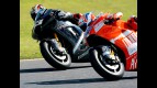 Casey Stoner and Marco Melandri riding side-by-side at MotoGP race in Motegi