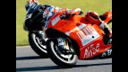 Casey Stoner and Marco Melandri riding side-by-side at MotoGP race in Motegi