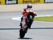 Casey Stoner pulls off a wheelie after the race in Jerez