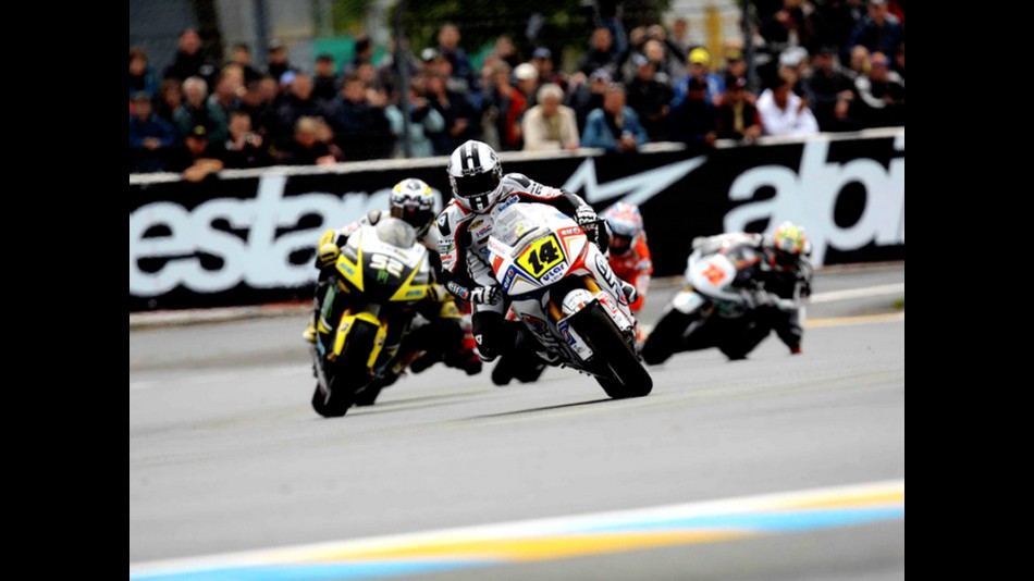 Randy de Puniet riding ahead of MotoGP group in Le Mans