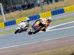 Dani Pedrosa riding ahead of Randy de Puniet in Le Mans