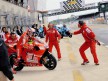 Stoner and Vermeulen during bike change in Le Mans