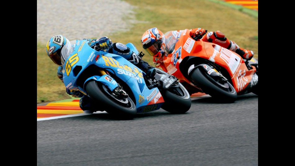 Loris Capirossi riding ahead of Casey Stoner in Mugello