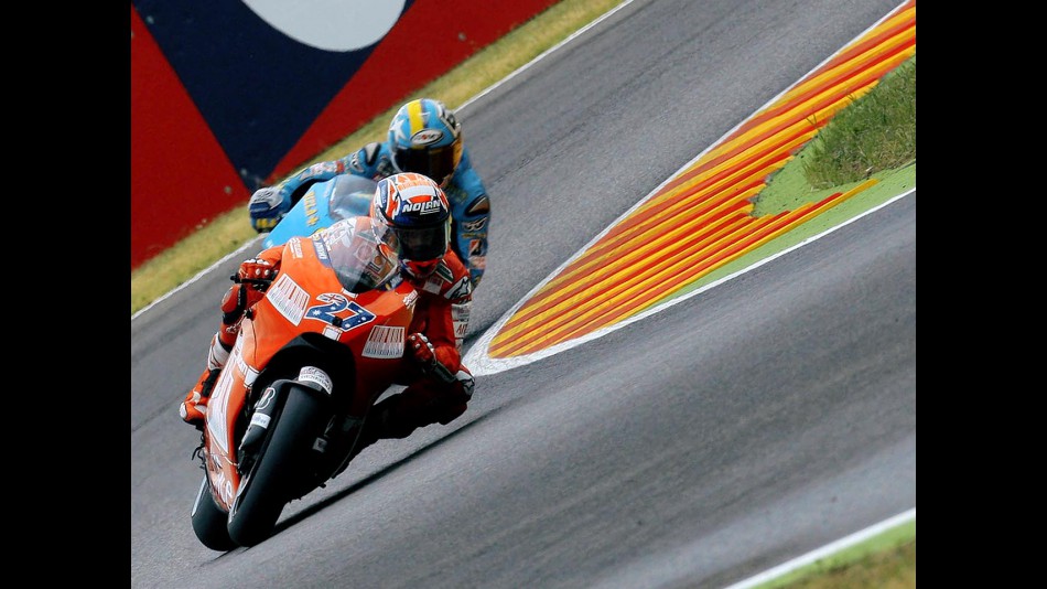 Casey Stoner riding ahead of Loris Capirossi in Mugello