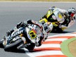 Randy de Puniet riding ahead Colin Edwards in Montmeló