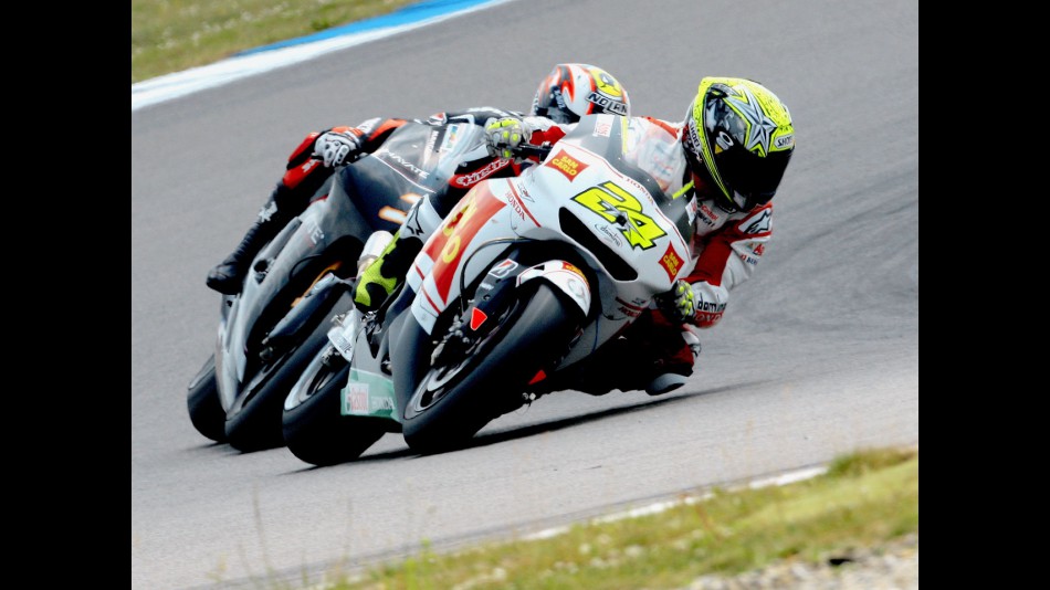 Toni Elias riding ahead of Marco Melandri in Assen