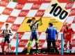 Valentino Rossi celebrates his 100th win on the podium in Assen