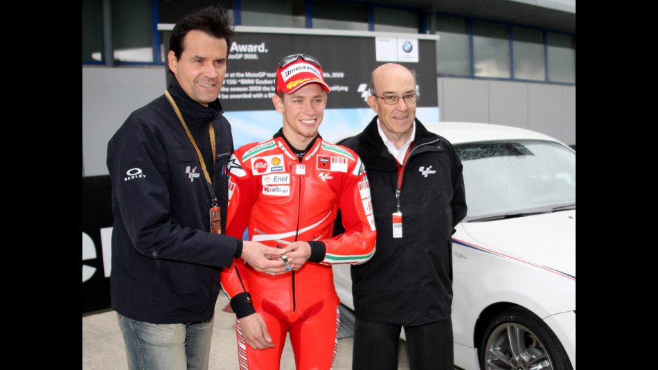 Thomas Schemera (BMW), Casey Stoner (Ducati Marlboro) and Carmelo Ezpeleta (Dorna)