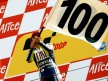 Valentino Rossi celebrates his 100th win on the podium in Assen