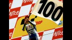 Valentino Rossi celebrates his 100th win on the podium in Assen