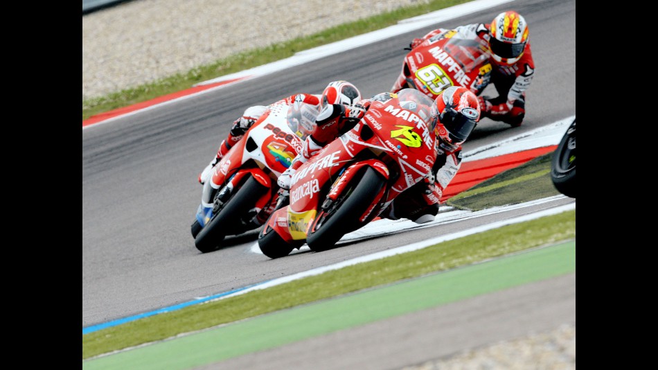 Álvaro Bautista riding ahead of 250cc group in Assen