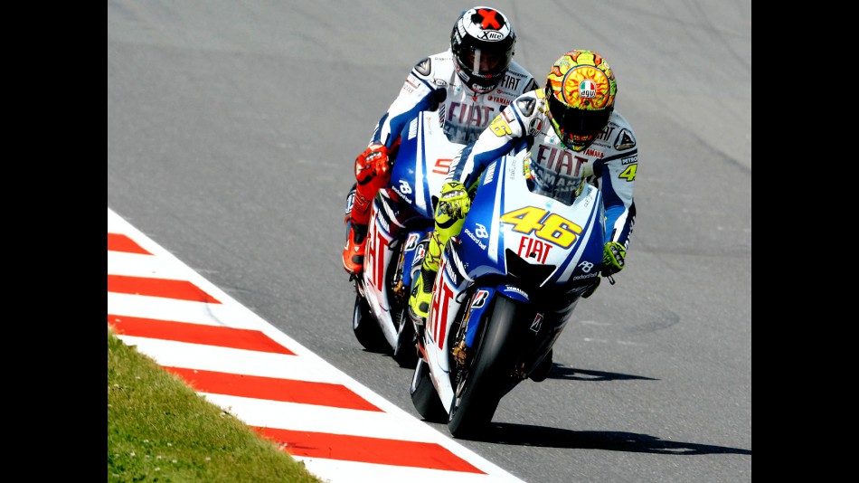 Valentino Rossi riding ahead of Jorge Lorenzo in Sachsenring