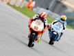 Marco Simoncelli riding ahead of Alex Debon in Sachsenring