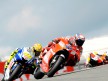 Casey Stoner riding ahead of Valentino Rossi in Sachsenring