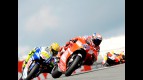 Casey Stoner riding ahead of Valentino Rossi in Sachsenring