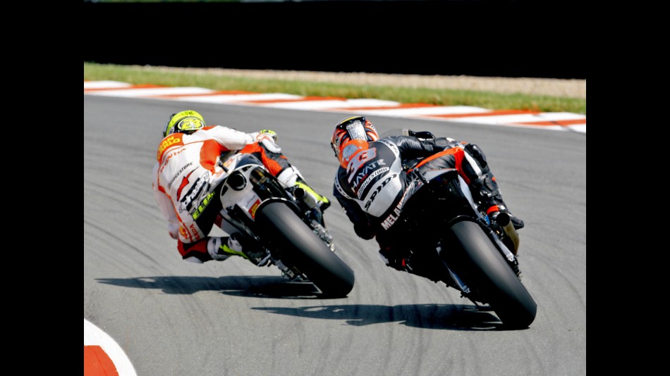 Toni Elias riding ahead of Marco Melandri in Assen