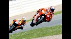 Casey Stoner riding ahead of Dani Pedrosa in Sachsenring