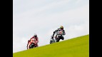 Gabor Talmacsi riding ahead of Nicky Hayden in Donington