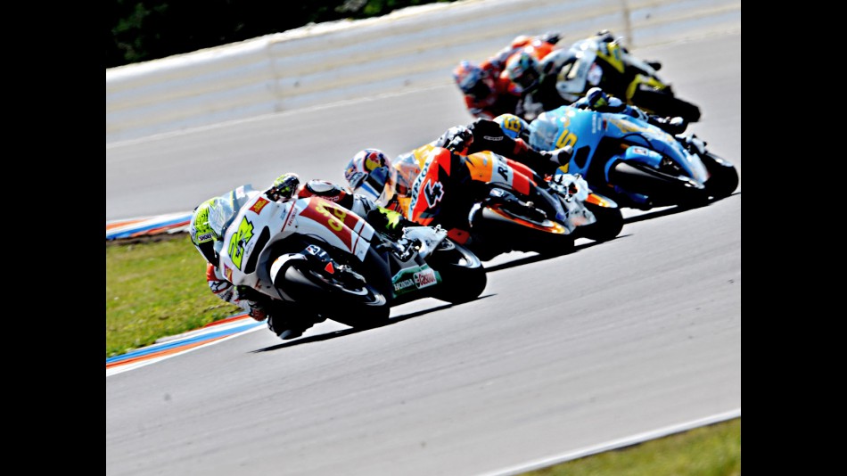 Toni Elias and Andrea Dovizioso riding ahead of MotoGP group in Brno
