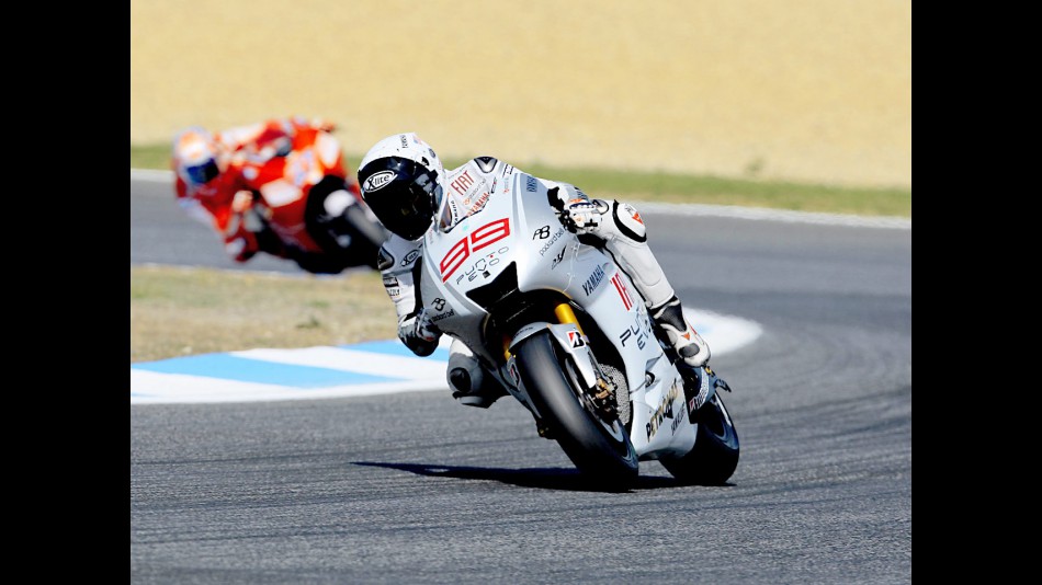Lorenzo riding ahead of Stoner in Estoril