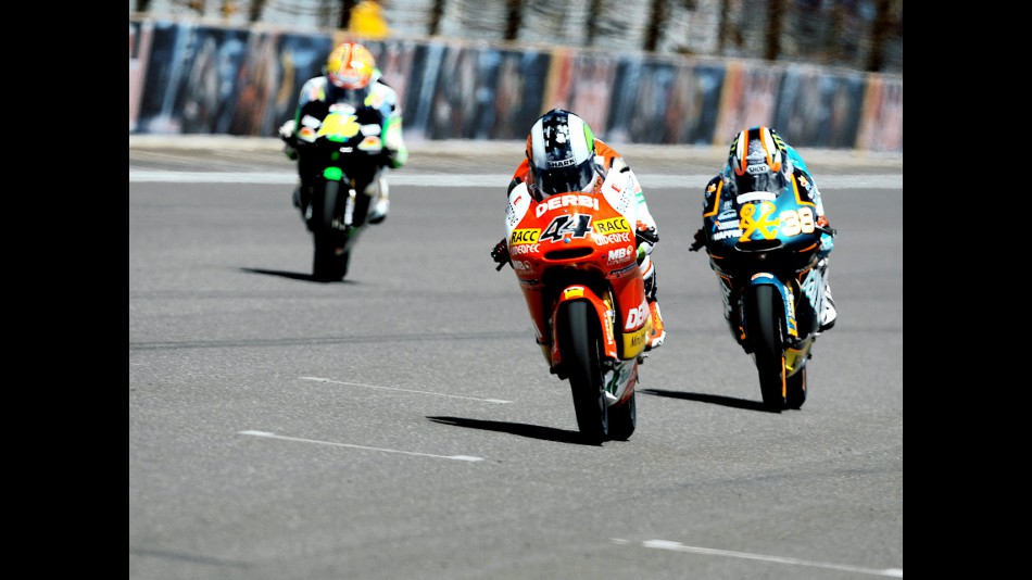 Pol Espargaró riding ahead of Smith and Corsi at Red Bull Indianapolis Grand Prix