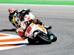 Alex de Angelis riding ahead of Gabor Talmacsi in Misano