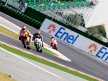 Andrea Dovizioso riding ahead of Gabor Talmacsi in Misano