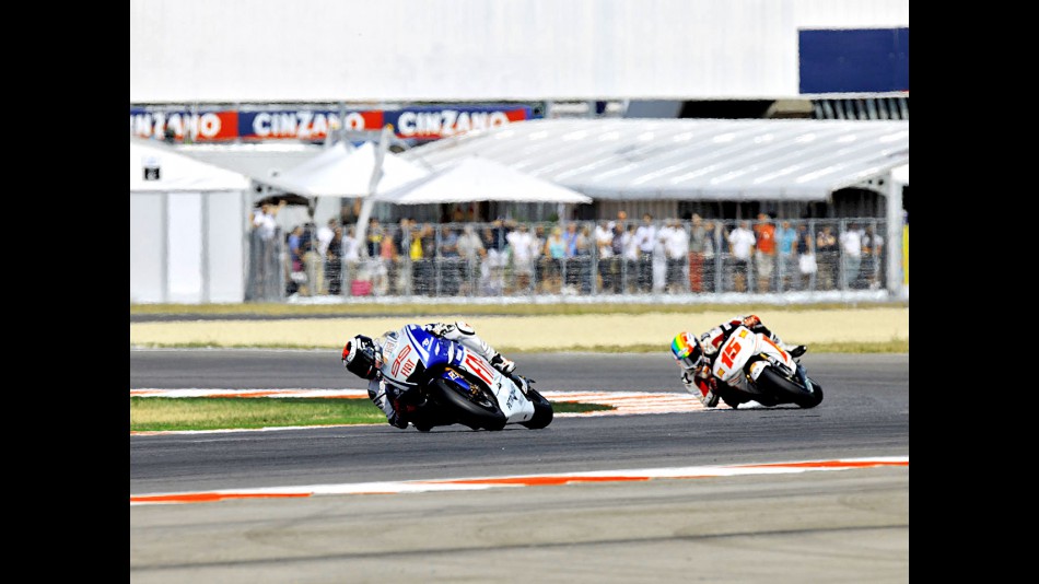 Jorge Lorenzo riding ahead of Alex de Angelis in Misano
