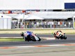 Jorge Lorenzo riding ahead of Alex de Angelis in Misano