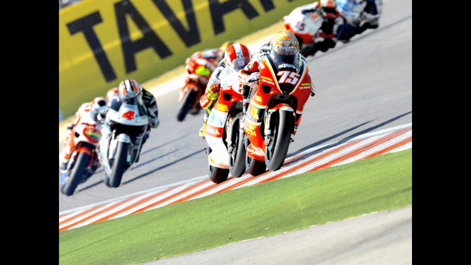 Mattia Pasini riding ahead of 250cc group in Misano
