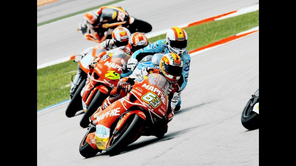 Mike di Meglio riding ahead of 250cc group in Sepang