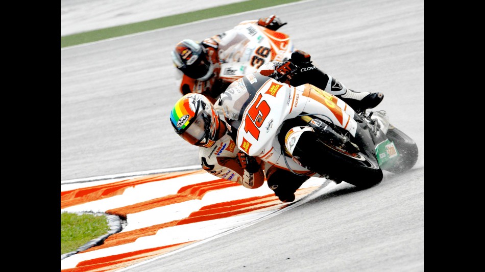 De Angelis riding ahead of Kallio in Sepang