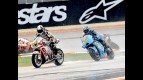 Randy de Puniet riding ahead of Capirossi in Sepang